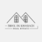 black and white minimalist real estate logo